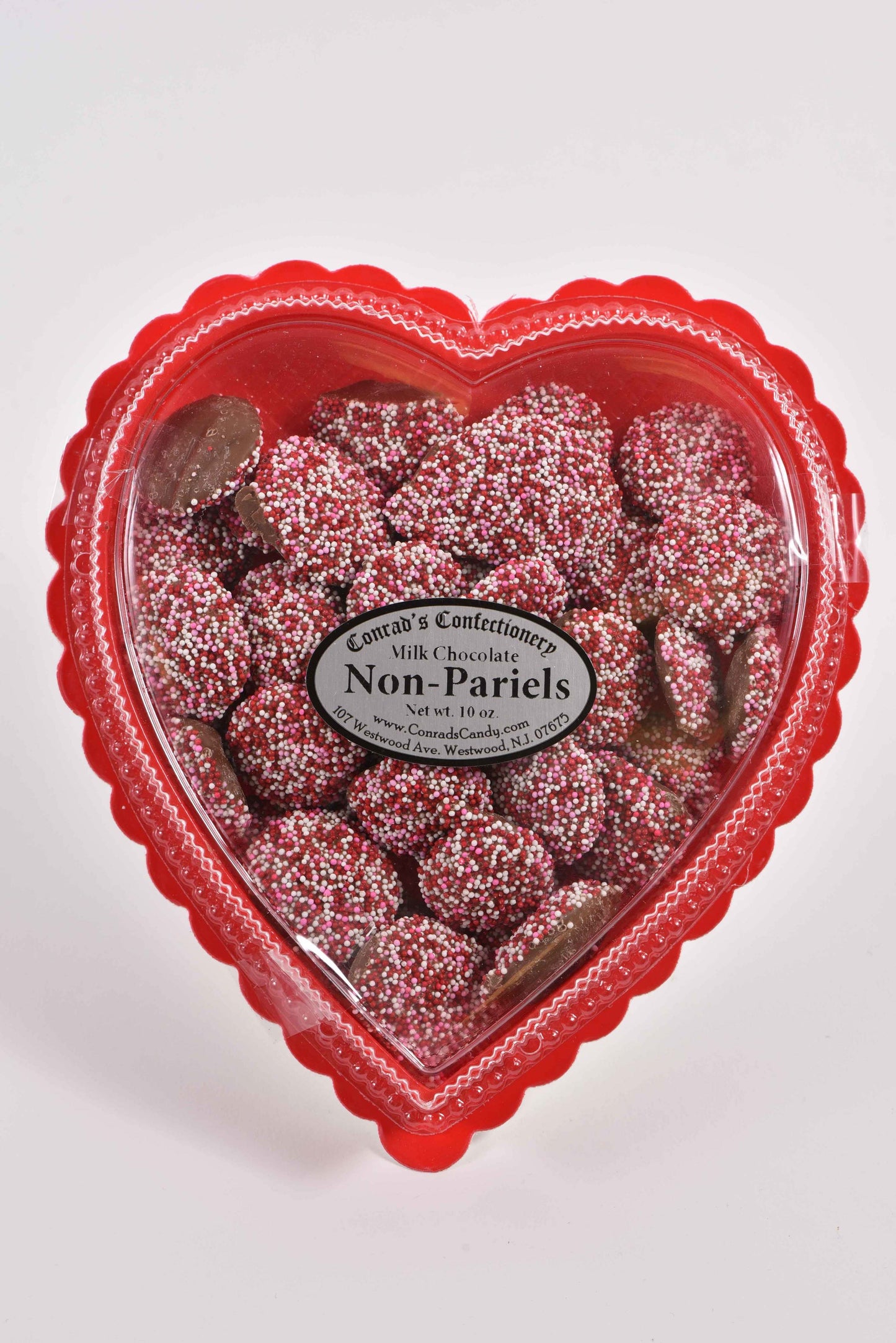 Valentine's Day Milk Chocolate Non-Pareils in Clear Plastic Heart Shaped Box (10oz) - Conrad's Confectionery